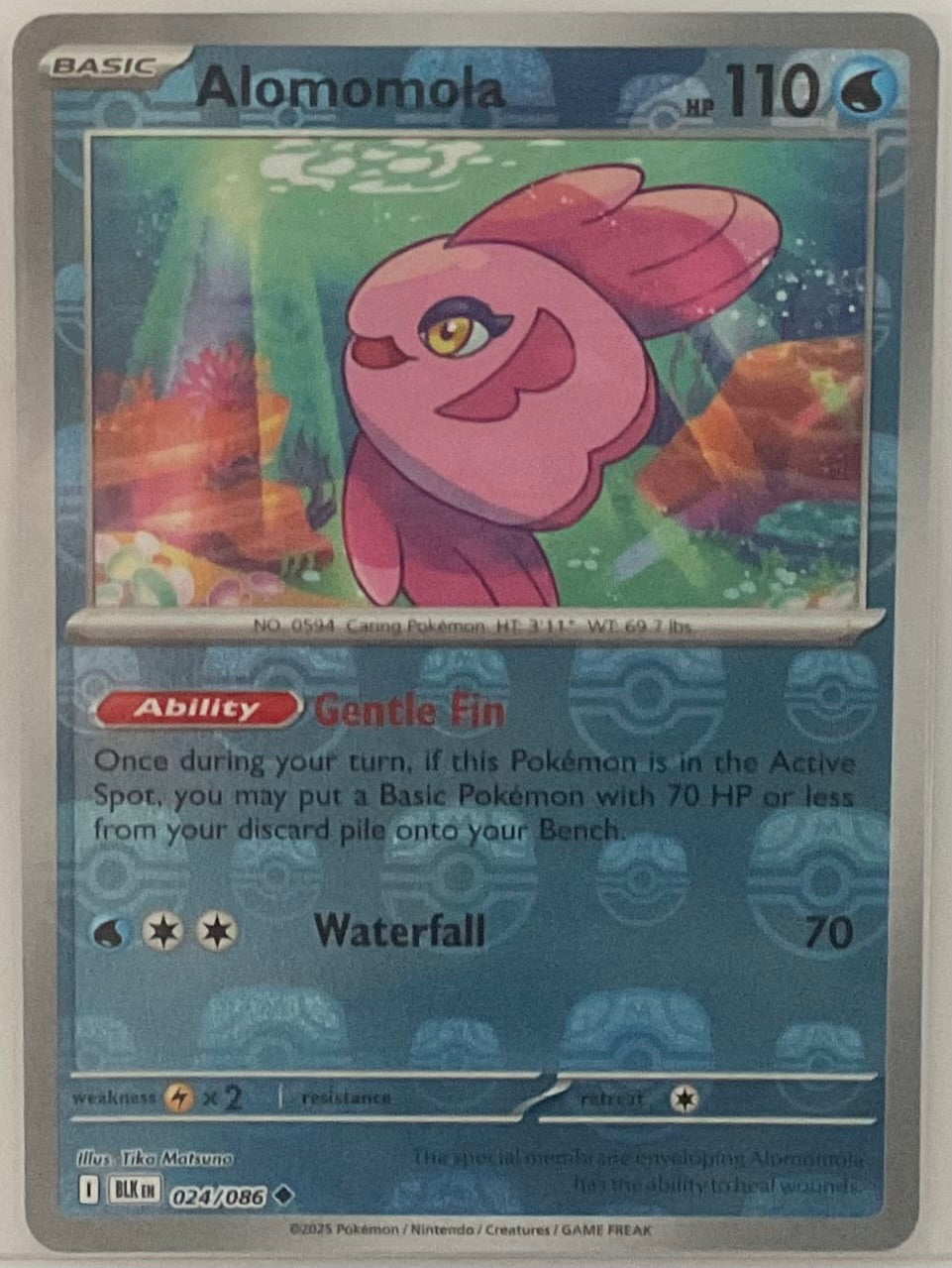 Pokémon trading card featuring Alomomola with detailed artwork and text.